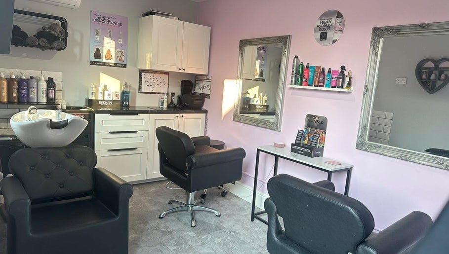 Modern interior of Hair by Emmie in Sudbury, England, GB with stylish chairs and beauty products.