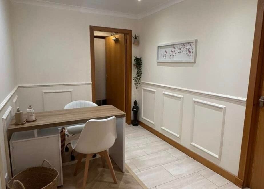 Welcoming entrance of El’Hara Beauty in Prestwick, Scotland, GB, featuring a serene seating area.