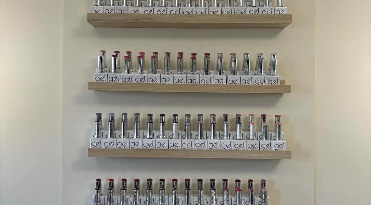 Nail polish gel display at El’Hara Beauty in Prestwick, Scotland. Organized shelves showcasing vibrant colors.