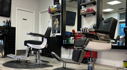 Modern barber chairs at Brotherhood Barber Shop Millrise, Calgary, Alberta, CA showcasing sleek design.