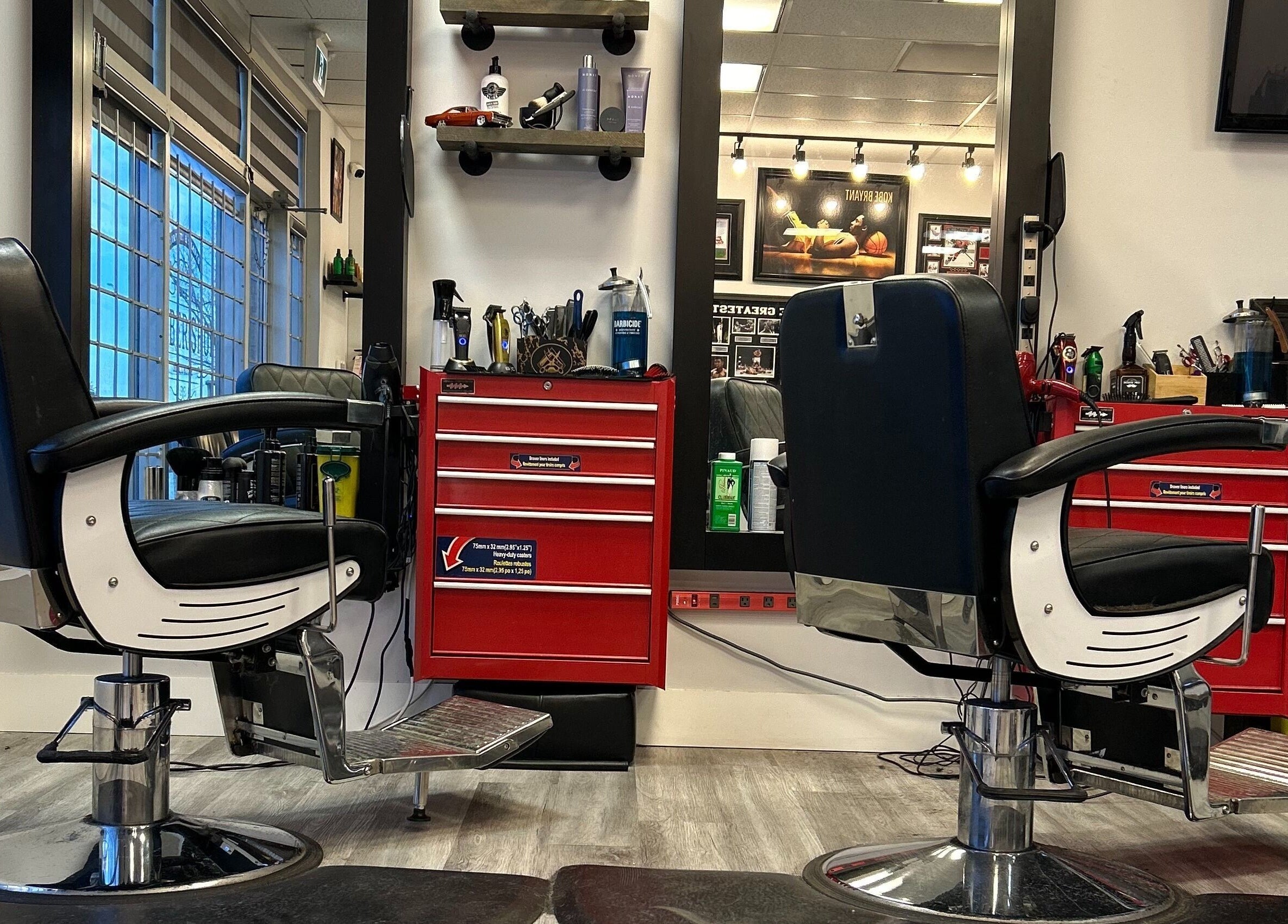 Brotherhood Barber Shop Millrise, Calgary, Alberta, CA features modern chairs and sleek styling stations.