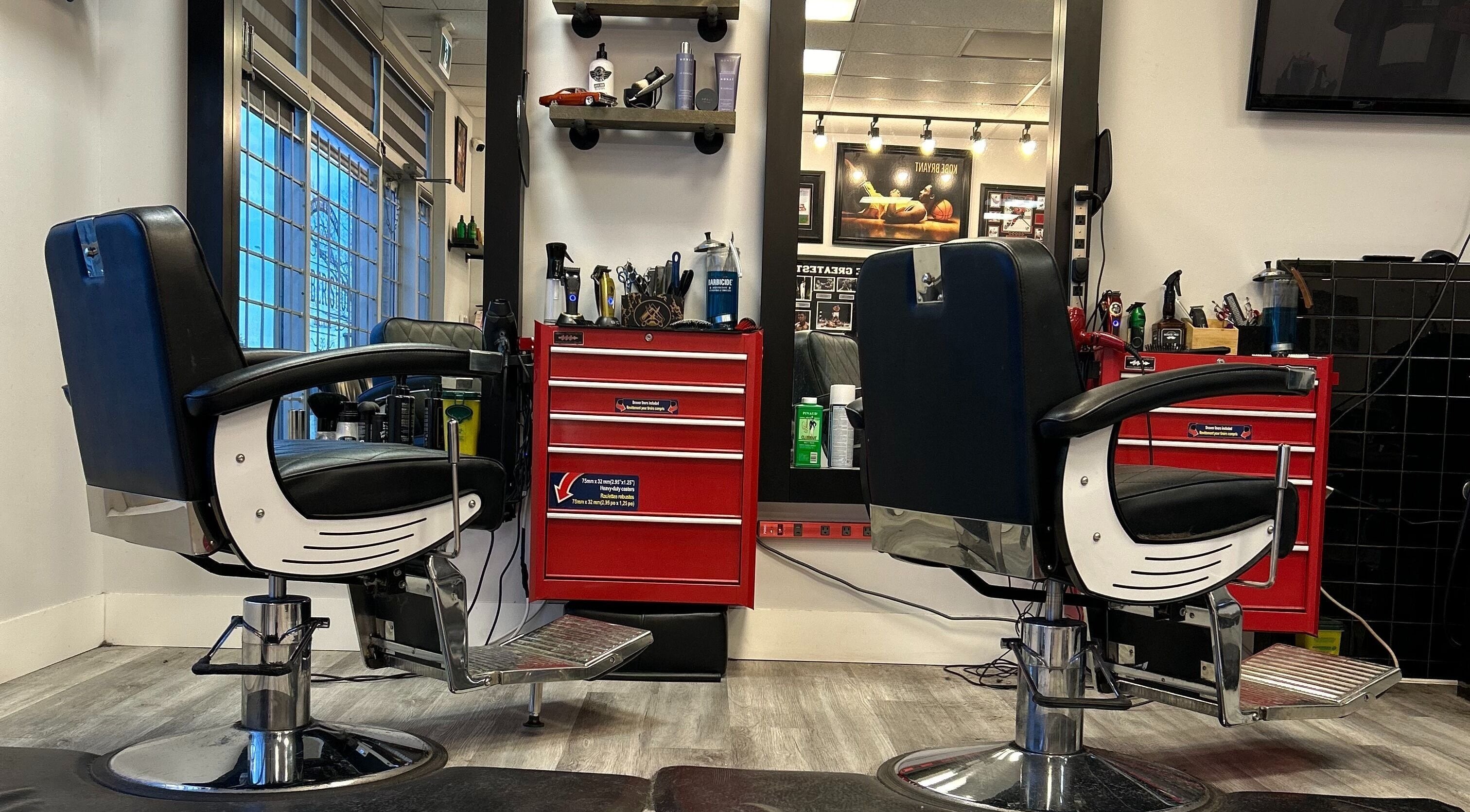 Brotherhood Barber Shop Millrise, Calgary, Alberta, CA features modern chairs and sleek styling stations.