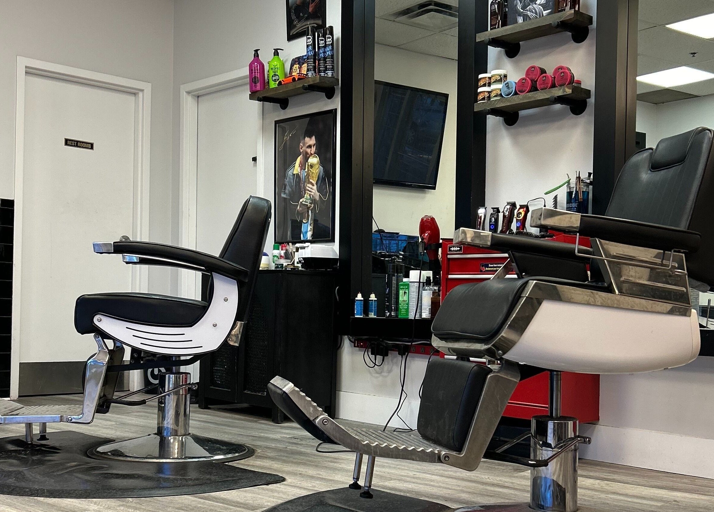 Stylish barber chairs at Brotherhood Barber Shop Millrise, Calgary, Alberta, CA, set against a modern backdrop.
