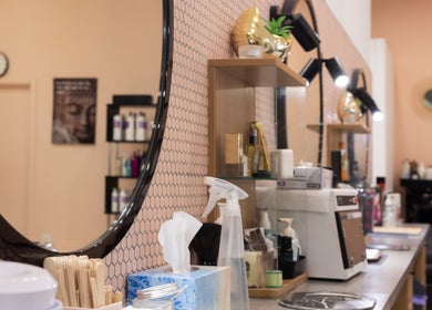 Modern salon interior with a decorative mirror at Grace Threading- Myer Centre, Brisbane City, Queensland, AU.