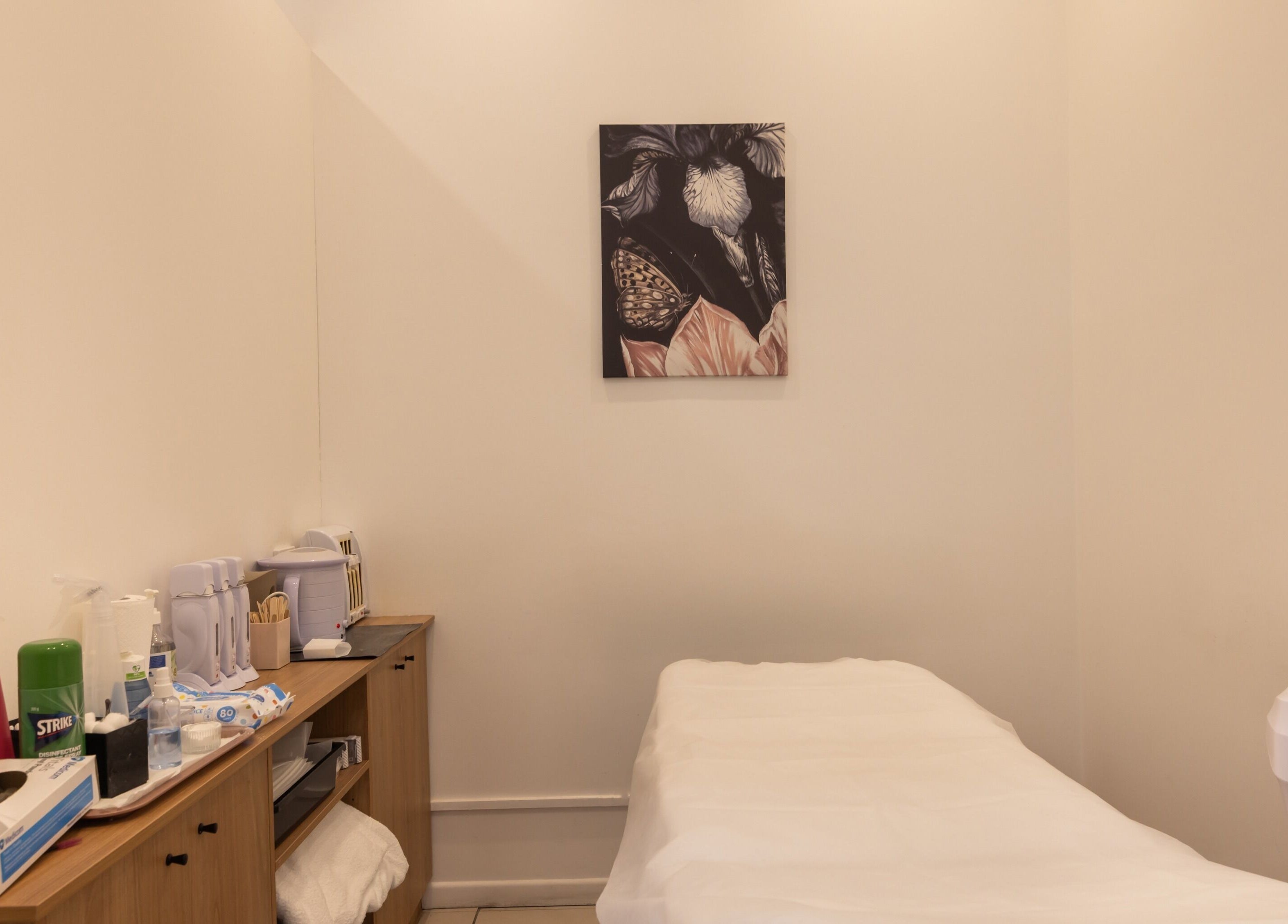 Treatment room at Grace Threading- Myer Centre, Brisbane City, Queensland, AU, with massage bed and decor.