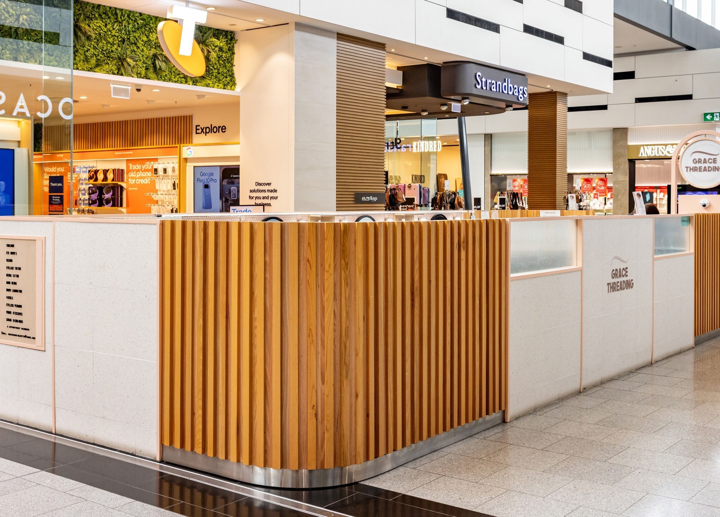 Grace Threading - Orion Springfield Central kiosk with wooden panels, Springfield Central, Queensland, AU.
