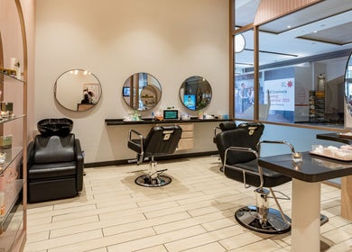 Elegant salon at Grace Beauty and Threading - Westfield Coomera, located in Coomera, Queensland, AU, with styling chairs and mirrors.