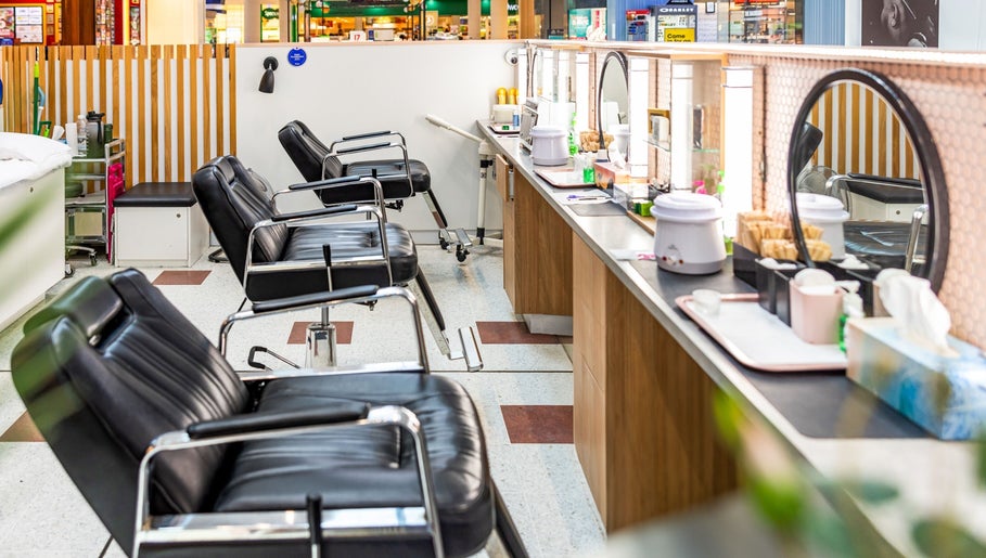 Chic interior of Grace Threading - Grand Plaza, Browns Plains, Queensland, AU, showcasing black salon chairs.