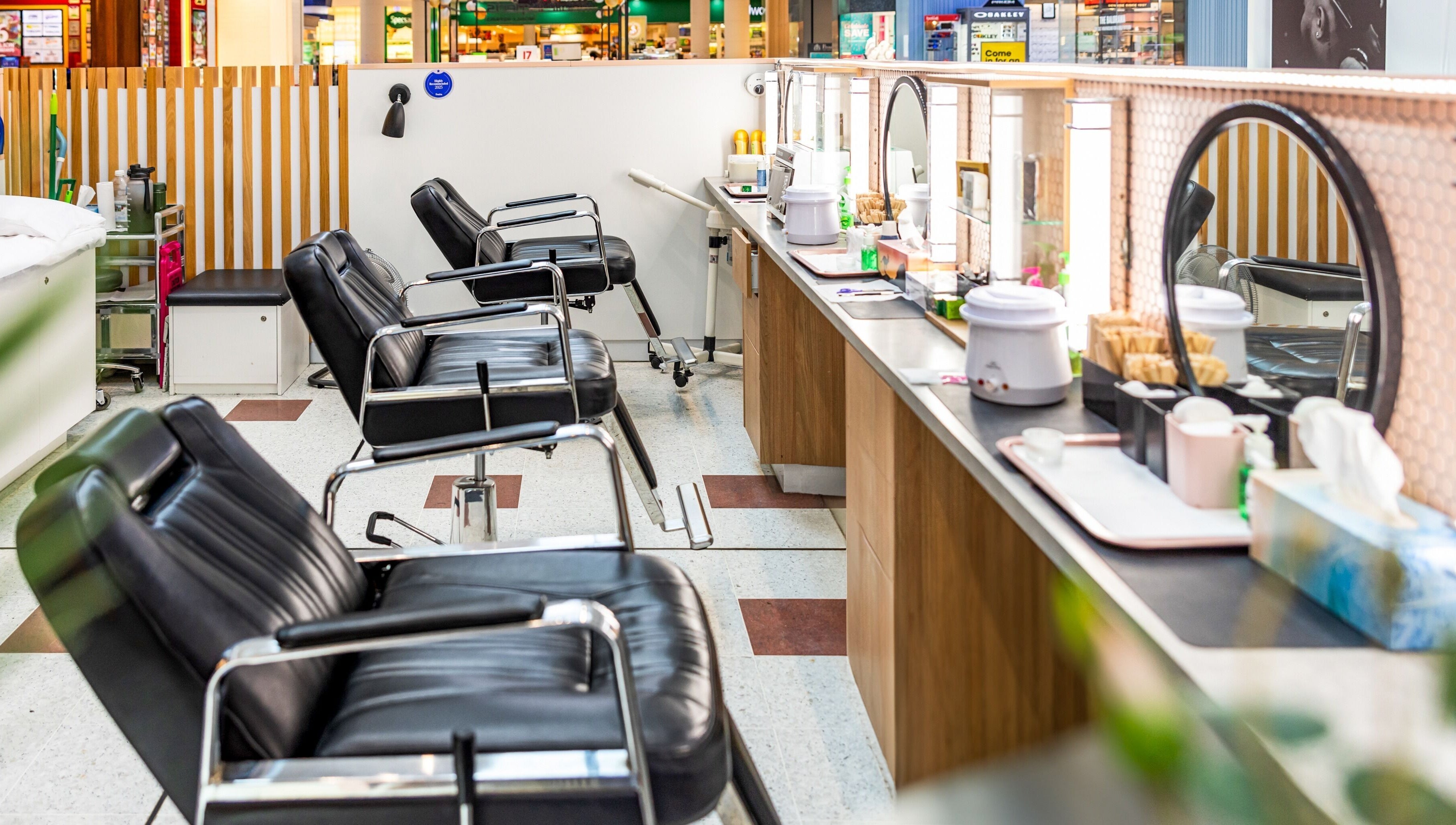 Chic interior of Grace Threading - Grand Plaza, Browns Plains, Queensland, AU, showcasing black salon chairs.