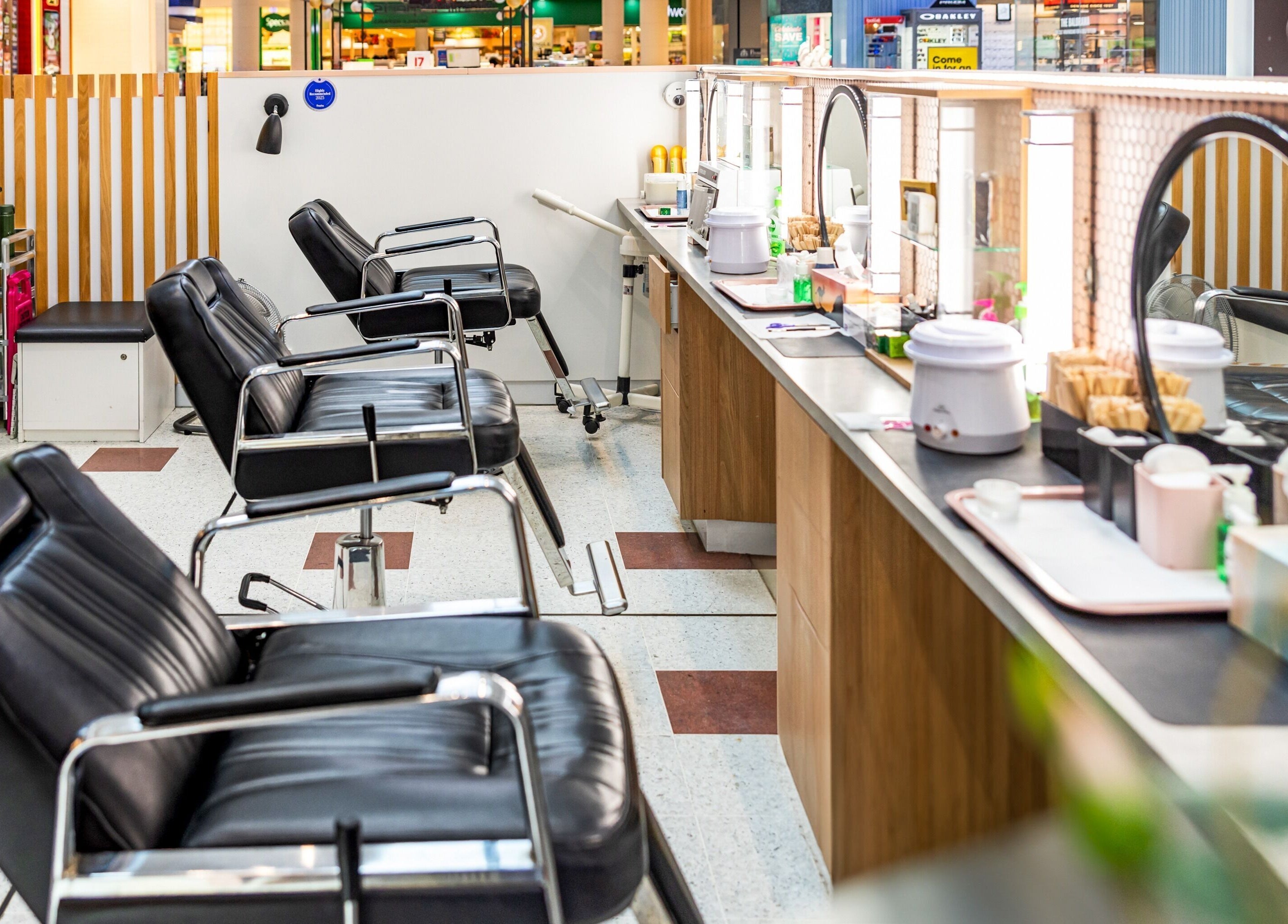 Chic interior of Grace Threading - Grand Plaza, Browns Plains, Queensland, AU, showcasing black salon chairs.