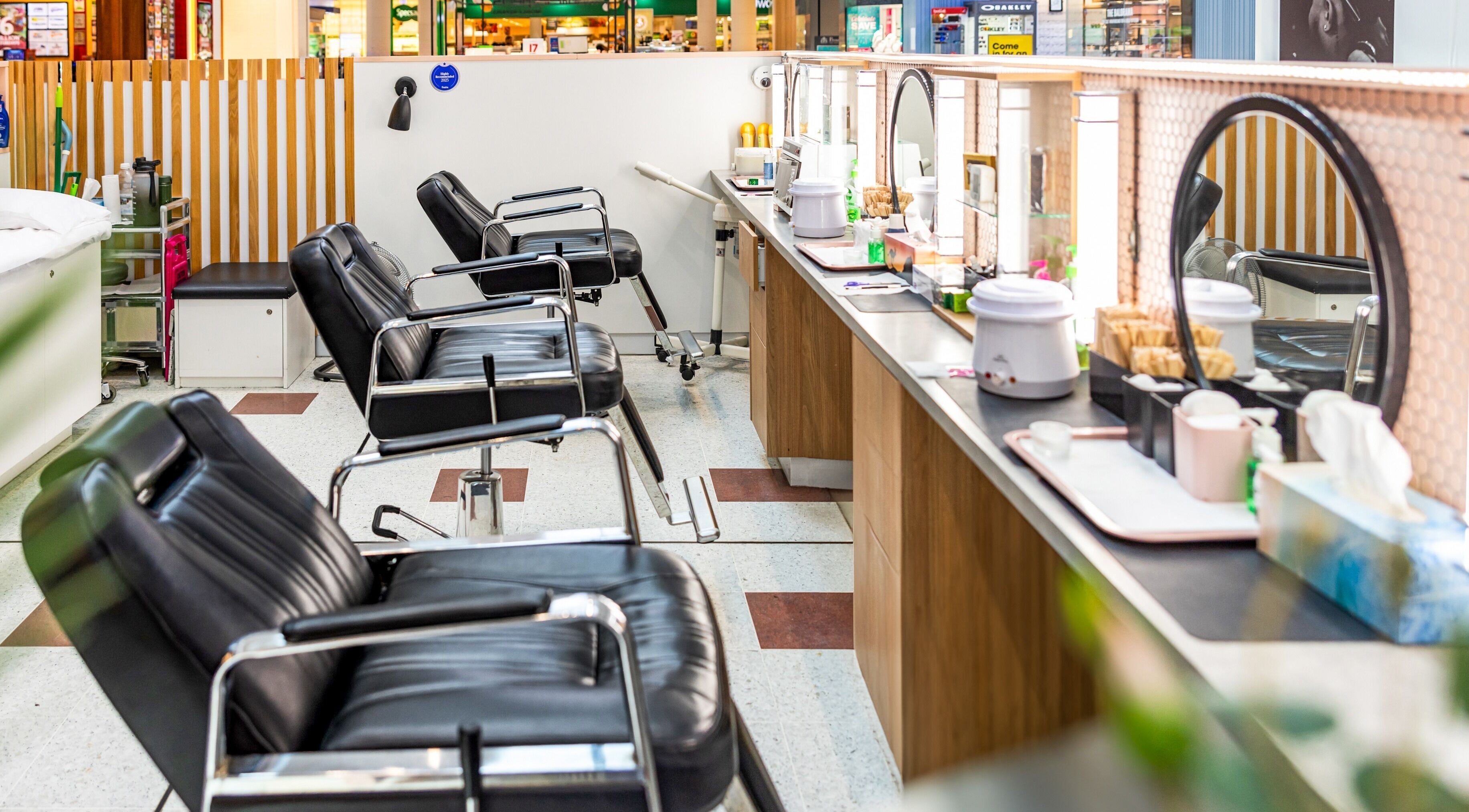 Chic interior of Grace Threading - Grand Plaza, Browns Plains, Queensland, AU, showcasing black salon chairs.