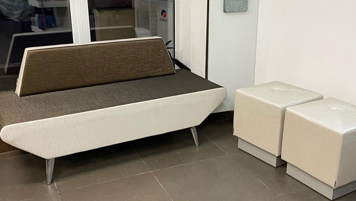 Elegant salon seating area at Sarah’s Unisex Salon in Saint Julian's, MT, featuring chic furniture.