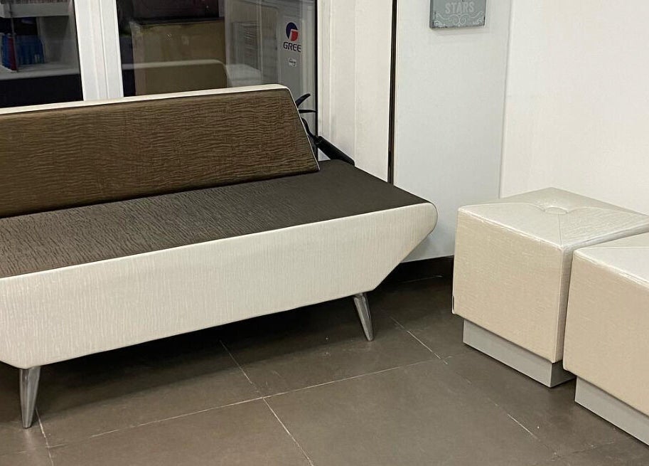 Elegant salon seating area at Sarah’s Unisex Salon in Saint Julian's, MT, featuring chic furniture.