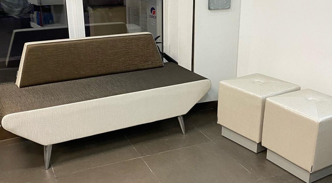 Elegant salon seating area at Sarah’s Unisex Salon in Saint Julian's, MT, featuring chic furniture.