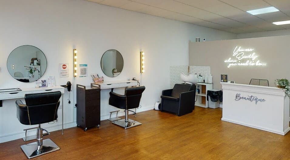 Bright, modern interior of Ellie Dainty at Beautique in Long Eaton, England, GB, featuring stylish salon stations.