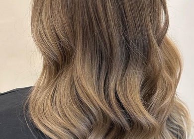 Elegant wavy hairstyle at Eden Hair at David Lloyd Long Ashton, Bristol, England, GB.
