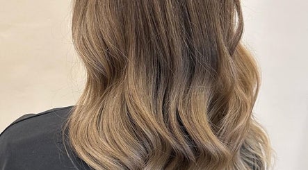 Elegant wavy hairstyle at Eden Hair at David Lloyd Long Ashton, Bristol, England, GB.