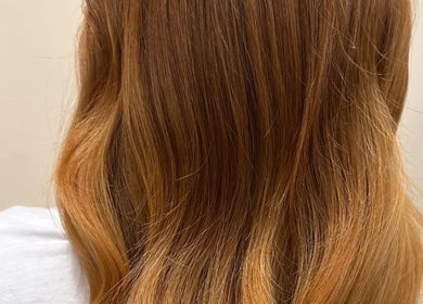 Elegant long golden brown hair styled at Eden Hair at David Lloyd Long Ashton, Bristol, England, GB.