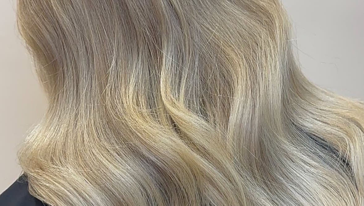Elegant blonde waves styled at Eden Hair at David Lloyd Long Ashton, Bristol, England, GB.