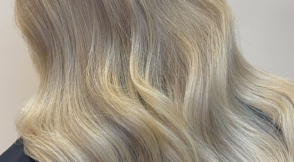 Elegant blonde waves styled at Eden Hair at David Lloyd Long Ashton, Bristol, England, GB.