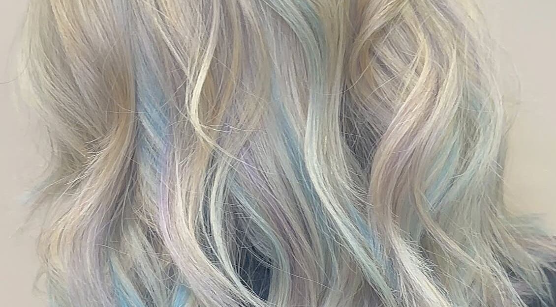 Pastel-colored wavy hairstyle at Eden Hair, David Lloyd Long Ashton, Bristol, England, GB.
