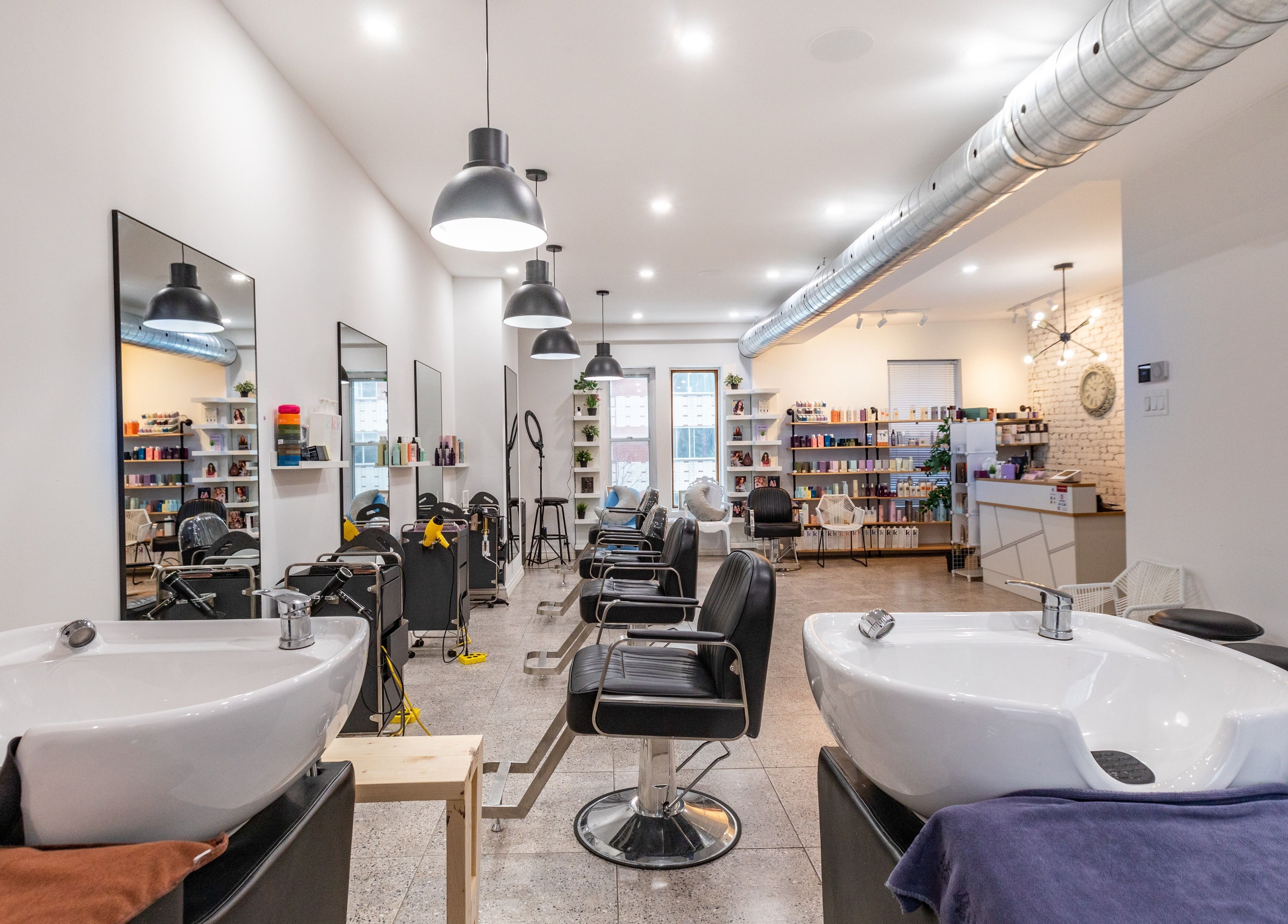 Modern salon interior at IN Salon-Saint-Mathieu (1439 saint-mathieu), Montréal, Québec, CA with styling chairs.