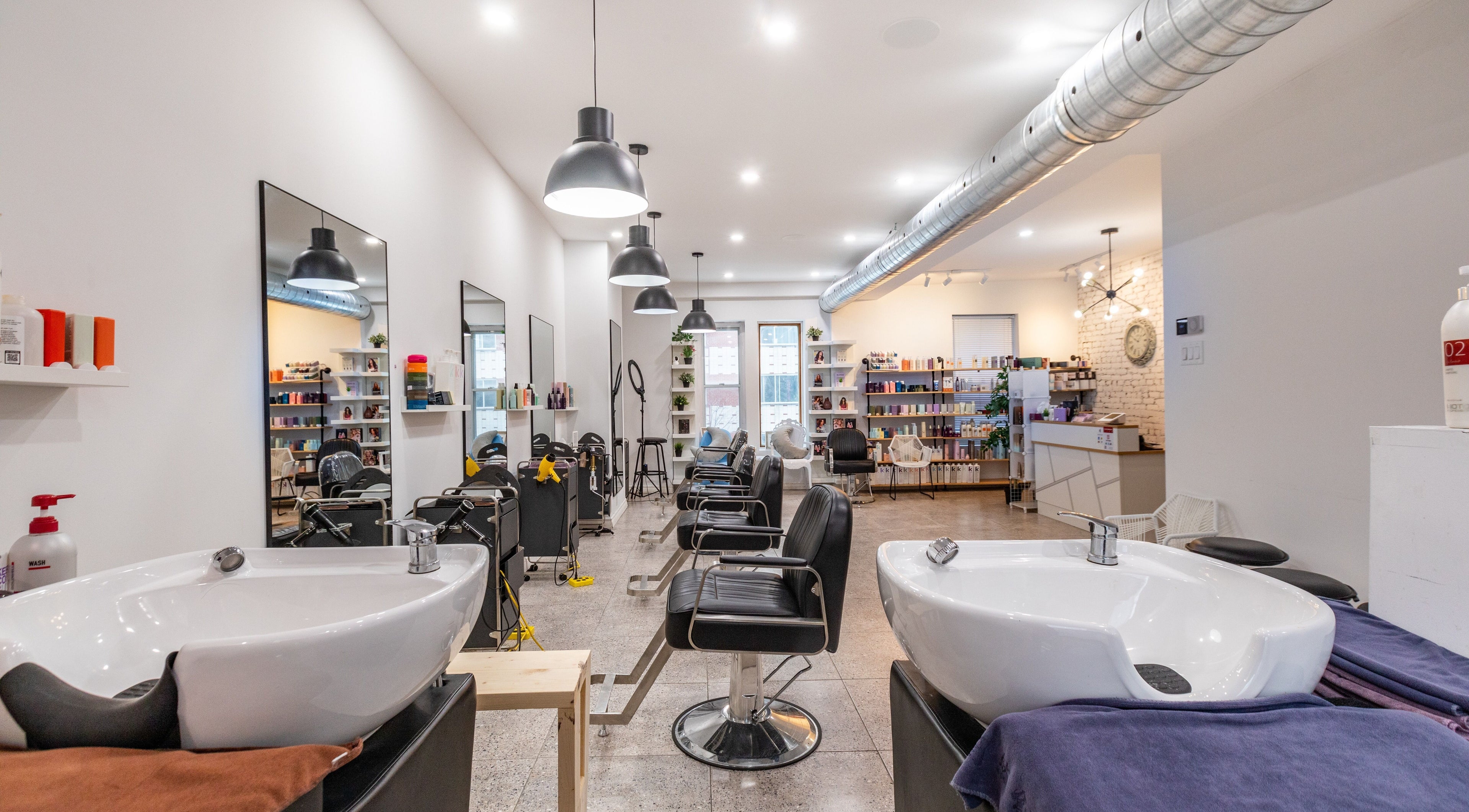 Modern salon interior at IN Salon-Saint-Mathieu (1439 saint-mathieu), Montréal, Québec, CA with styling chairs.