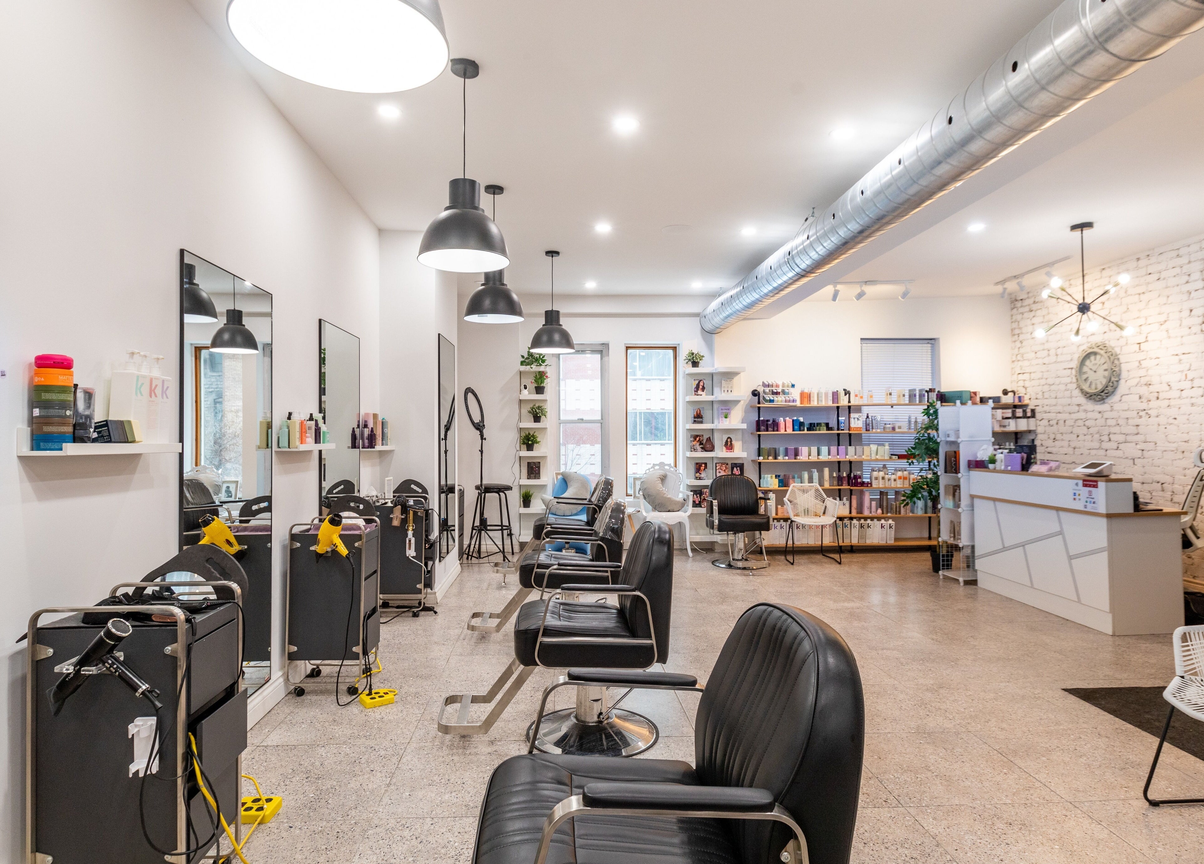Modern salon interior at IN Salon-Saint-Mathieu (1439 saint-mathieu), Montréal, Québec, CA, showcasing stylish seating.