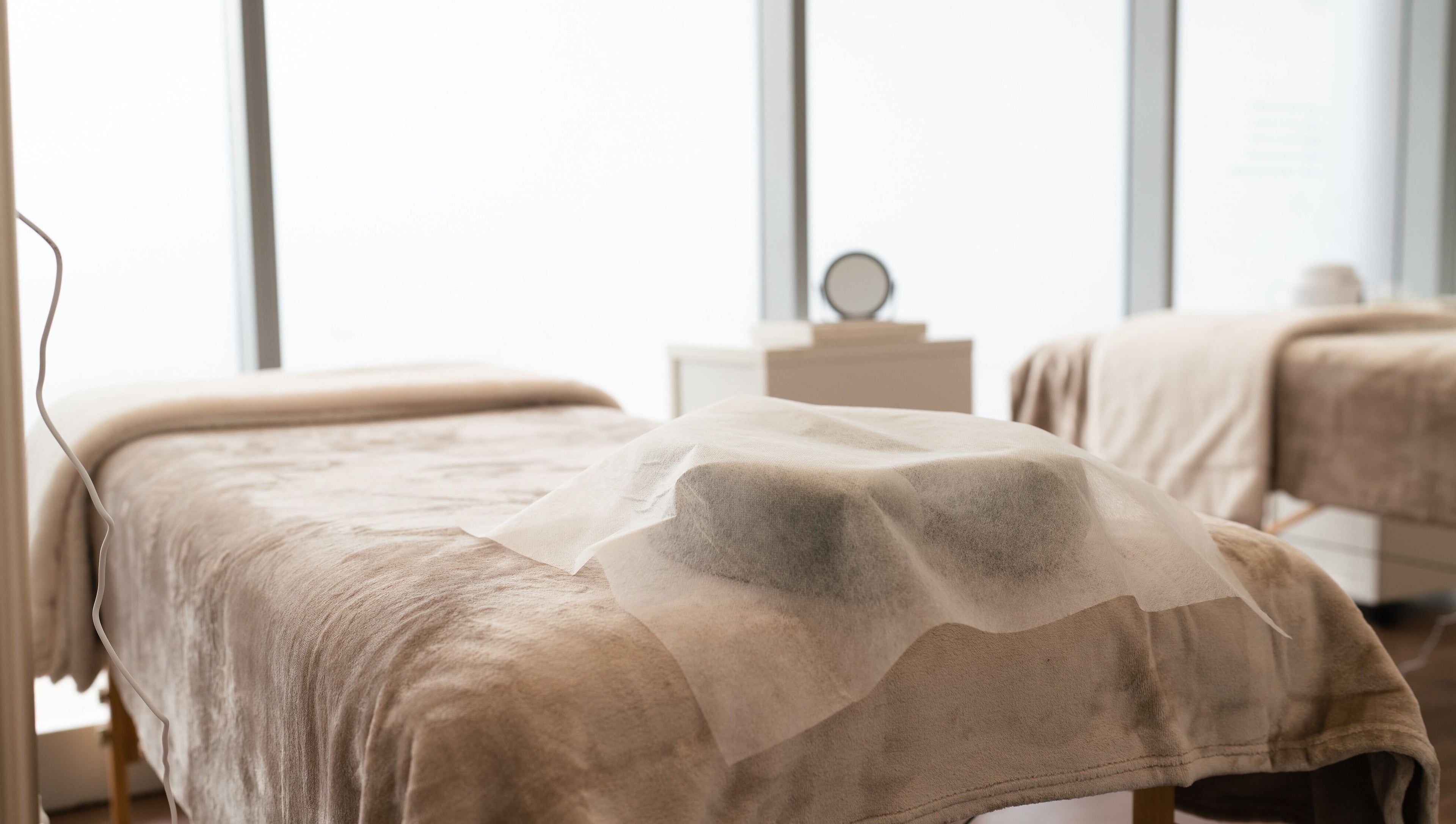 Relaxing treatment room at Theory Lash & Brow in Buddina, QLD, Queensland, AU with gentle lighting and soft linens.