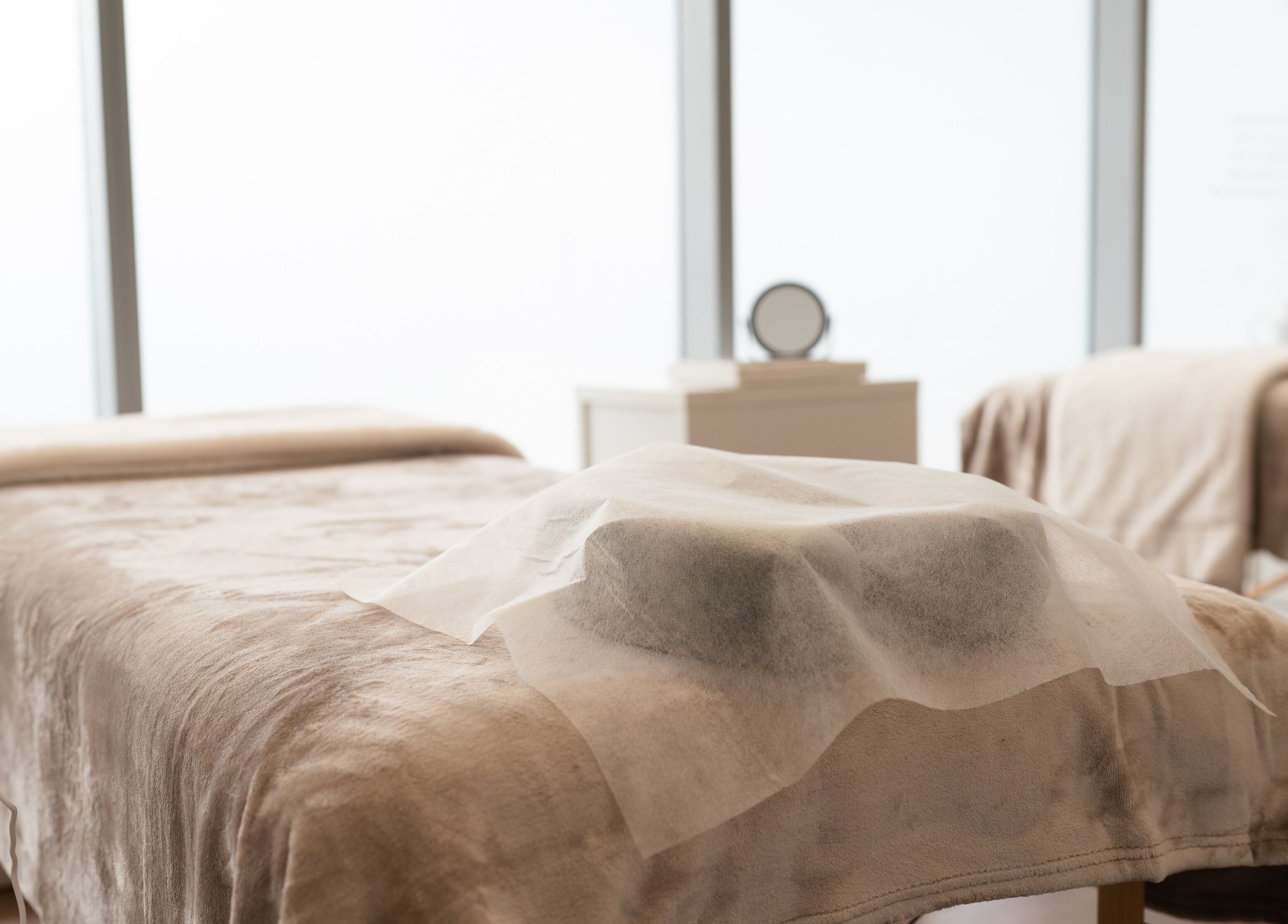 Relaxing treatment room at Theory Lash & Brow in Buddina, QLD, Queensland, AU with gentle lighting and soft linens.