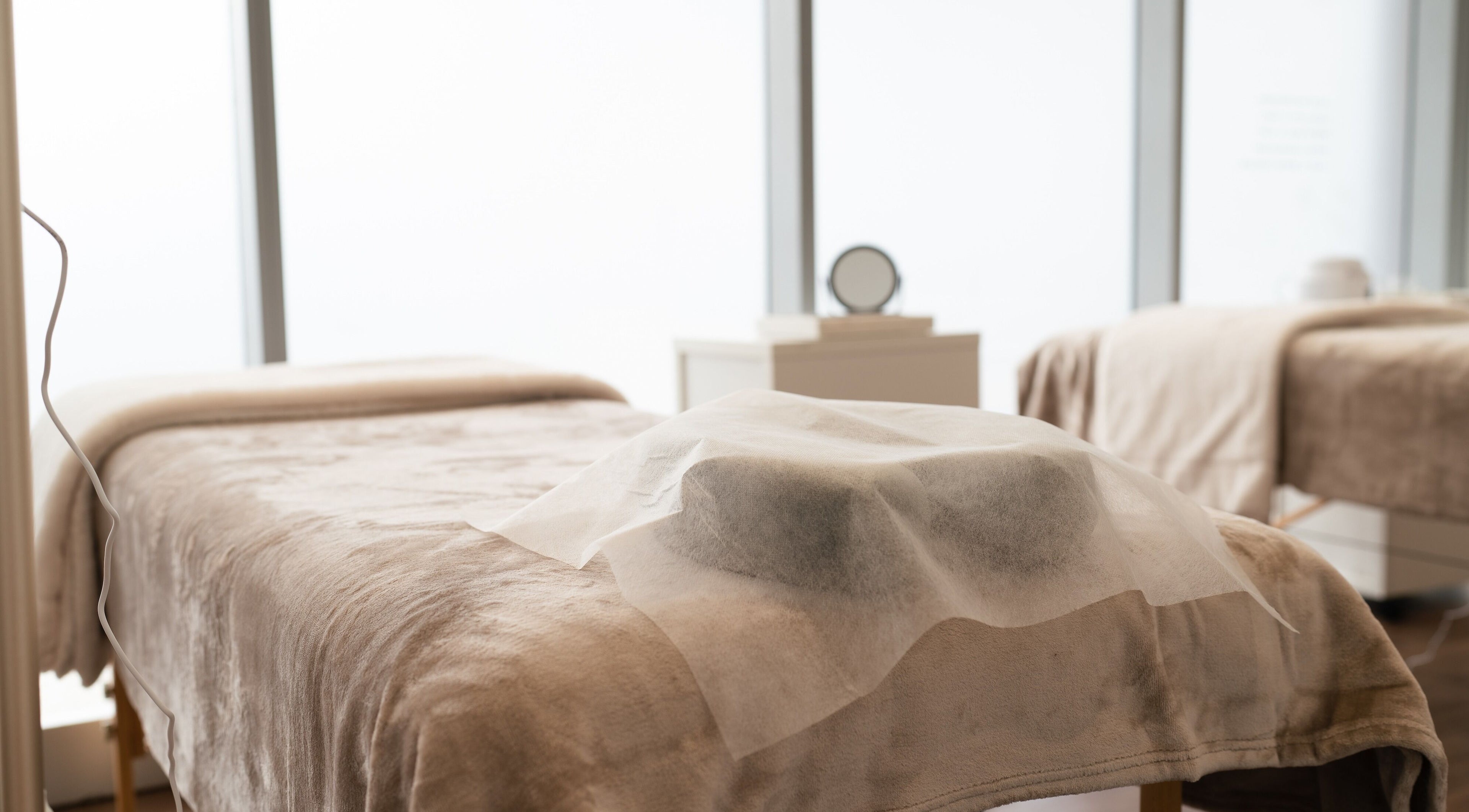 Relaxing treatment room at Theory Lash & Brow in Buddina, QLD, Queensland, AU with gentle lighting and soft linens.