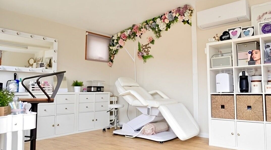 Elegant treatment room at Leanne Jackson Skin Bridal Brows in Blackburn, England, GB with a stylish reclining chair.