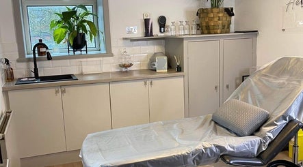 Cozy treatment room at Fitzys Hair and Beauty in Accrington, England, GB with a recliner and modern decor.