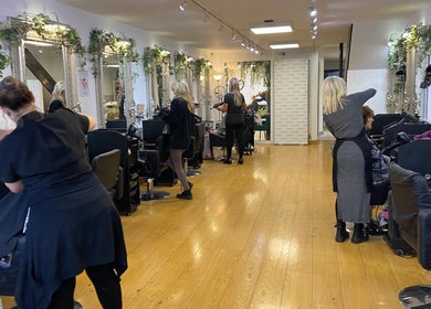 Stylish interior of Fitzys Hair and Beauty salon in Accrington, England, GB, showcasing elegant workstations.