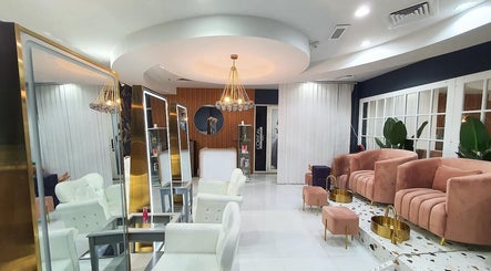 Modern chic salon interior at Las Meninas Salon - Dubailand, Dubai, Dubai, AE with plush seating and bright decor.