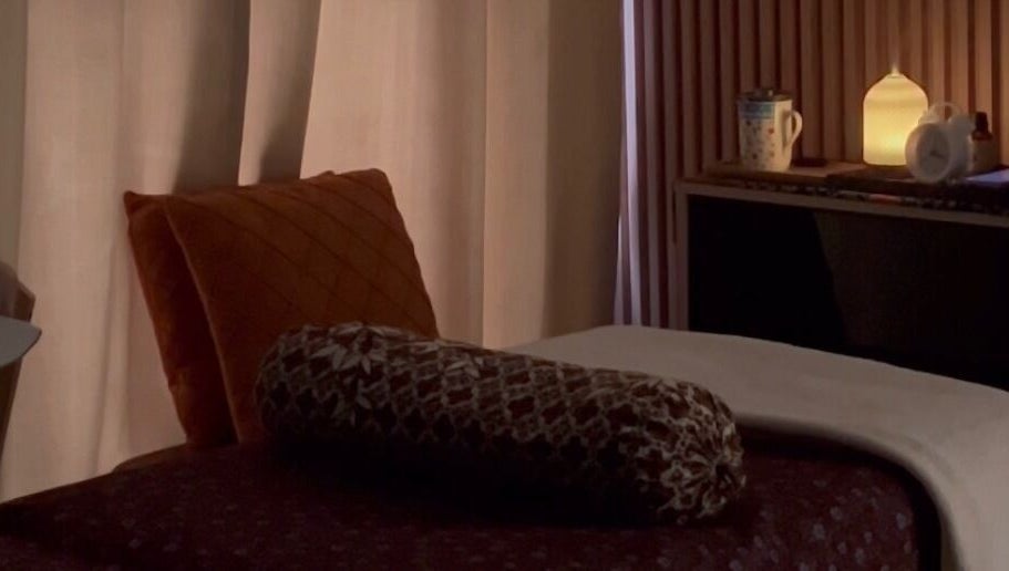 Relaxing massage room at Malaya Harmony Wellness, Kuala Lumpur, Wilayah Persekutuan KL, MY with dim lighting.