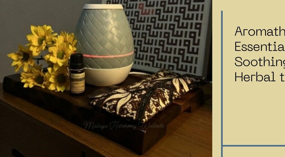 Aromatherapy setup at Malaya Harmony Wellness in Kuala Lumpur, featuring essential oils and yellow flowers.