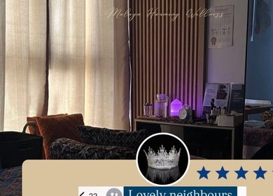 Cozy wellness room at Malaya Harmony Wellness, Kuala Lumpur, MY, featuring ambient lighting and plush seating.