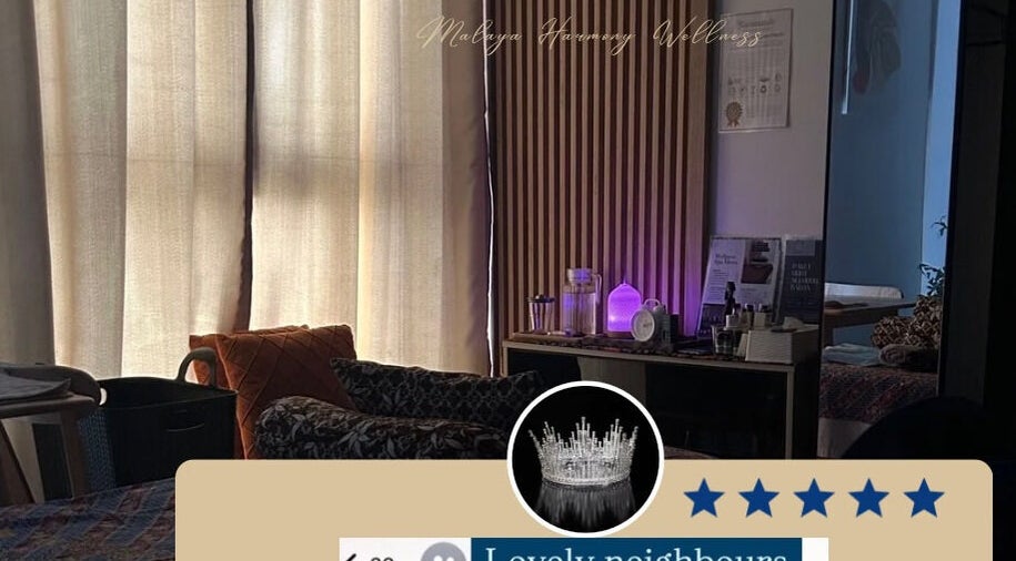 Cozy wellness room at Malaya Harmony Wellness, Kuala Lumpur, MY, featuring ambient lighting and plush seating.