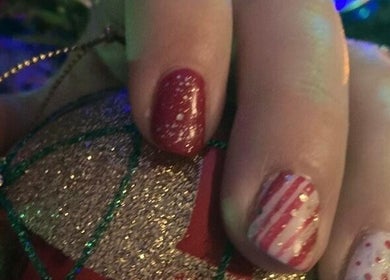 Festive glittery red and white nail art by Mud Beauty in Hook, England, GB.