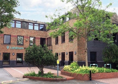Front view of Mud Beauty in Hook, England, GB featuring a brick facade and lush greenery.