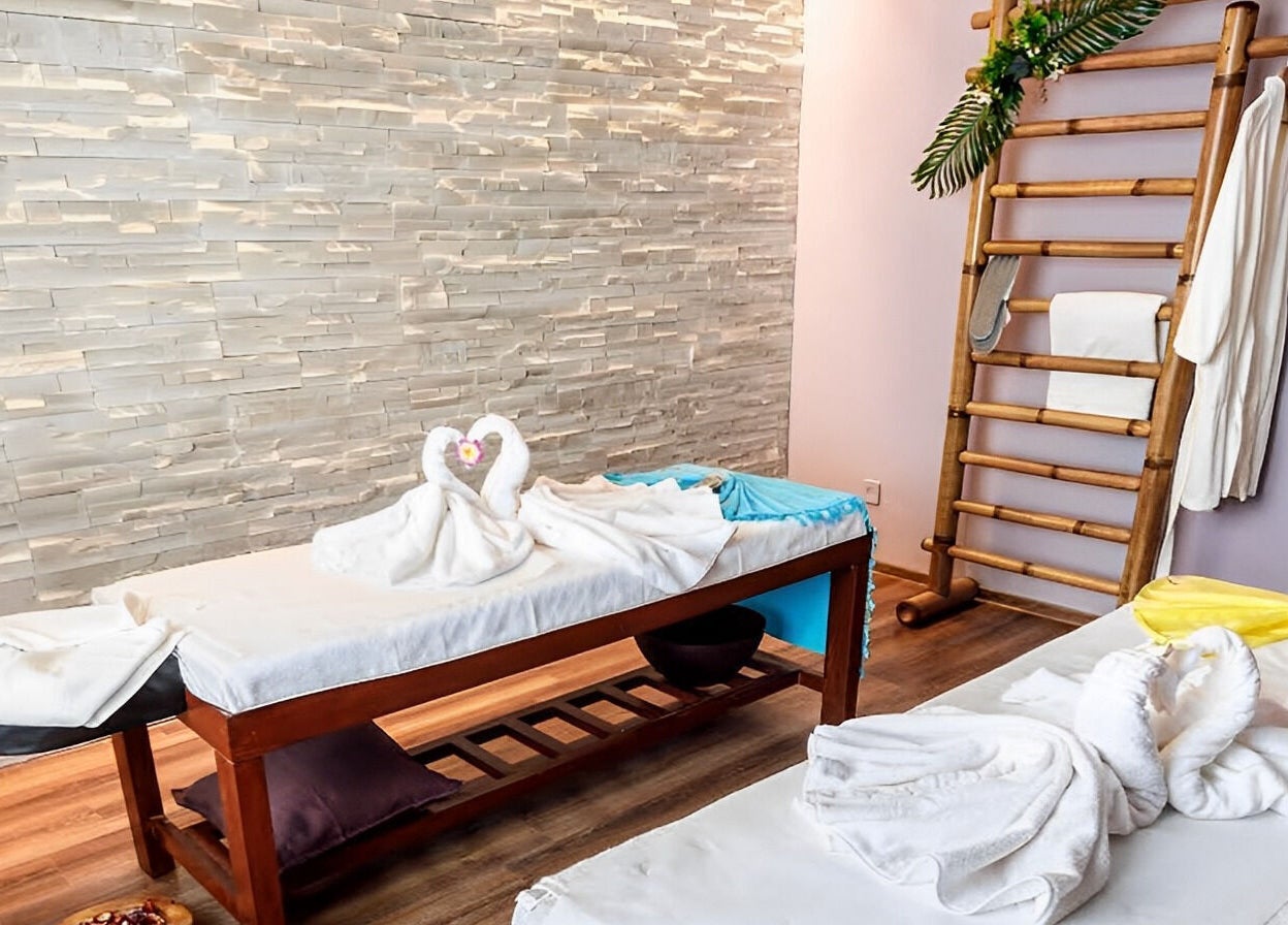 Relaxing massage tables at Bali Temple Spa, București, București, RO, adorned with towel swans and tropical decor.