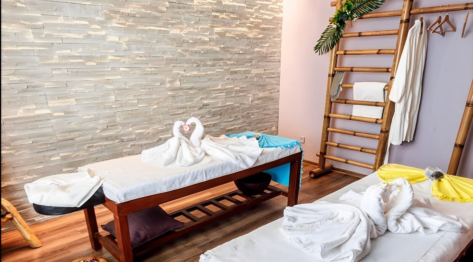 Relaxing massage tables at Bali Temple Spa, București, București, RO, adorned with towel swans and tropical decor.