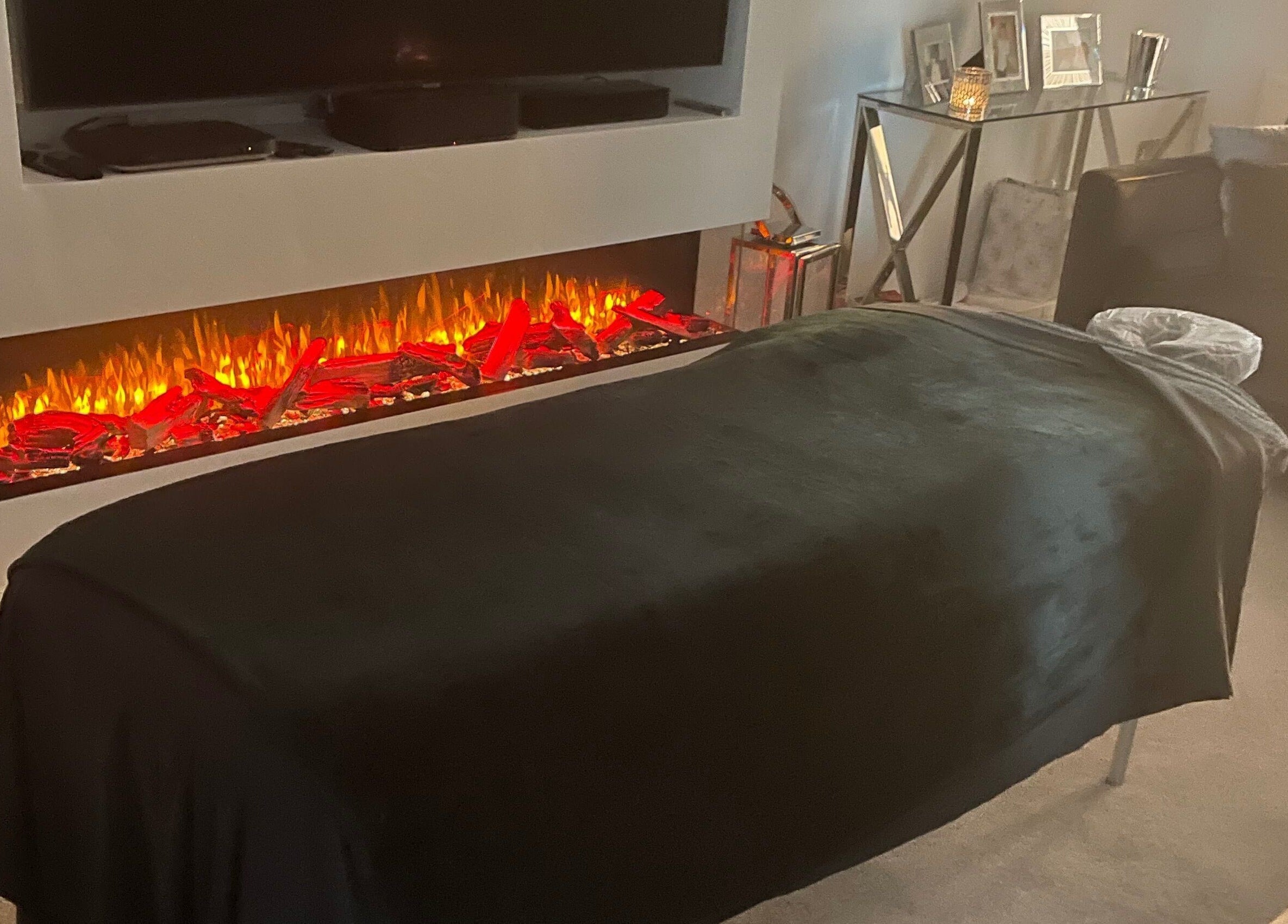 Relaxing spa setup at Graceful Aura - Mobile Services Liverpool, featuring a fireplace. Liverpool, England, GB.