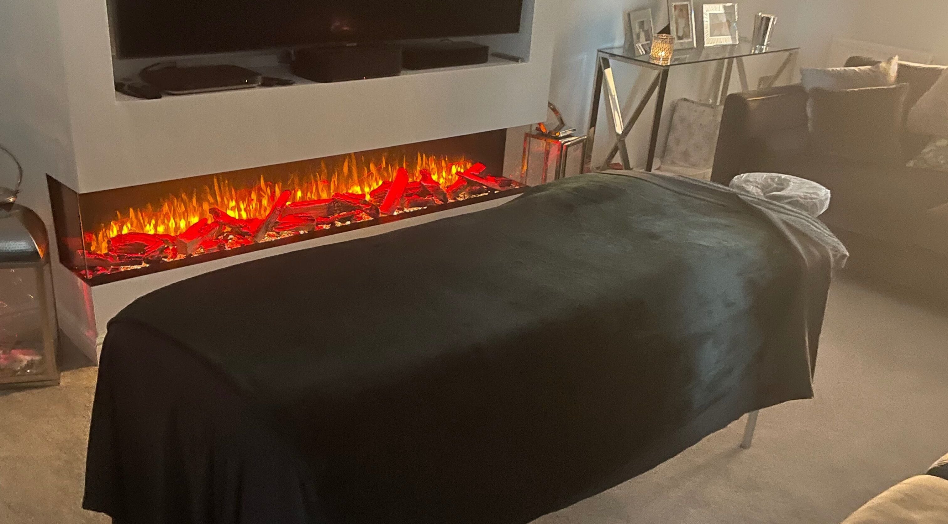 Relaxing spa setup at Graceful Aura - Mobile Services Liverpool, featuring a fireplace. Liverpool, England, GB.
