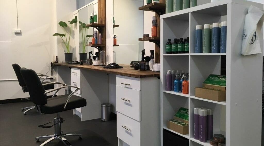 Modern salon setup at Cutting Crew Australia, Taree, New South Wales, AU, showcasing chairs and products.