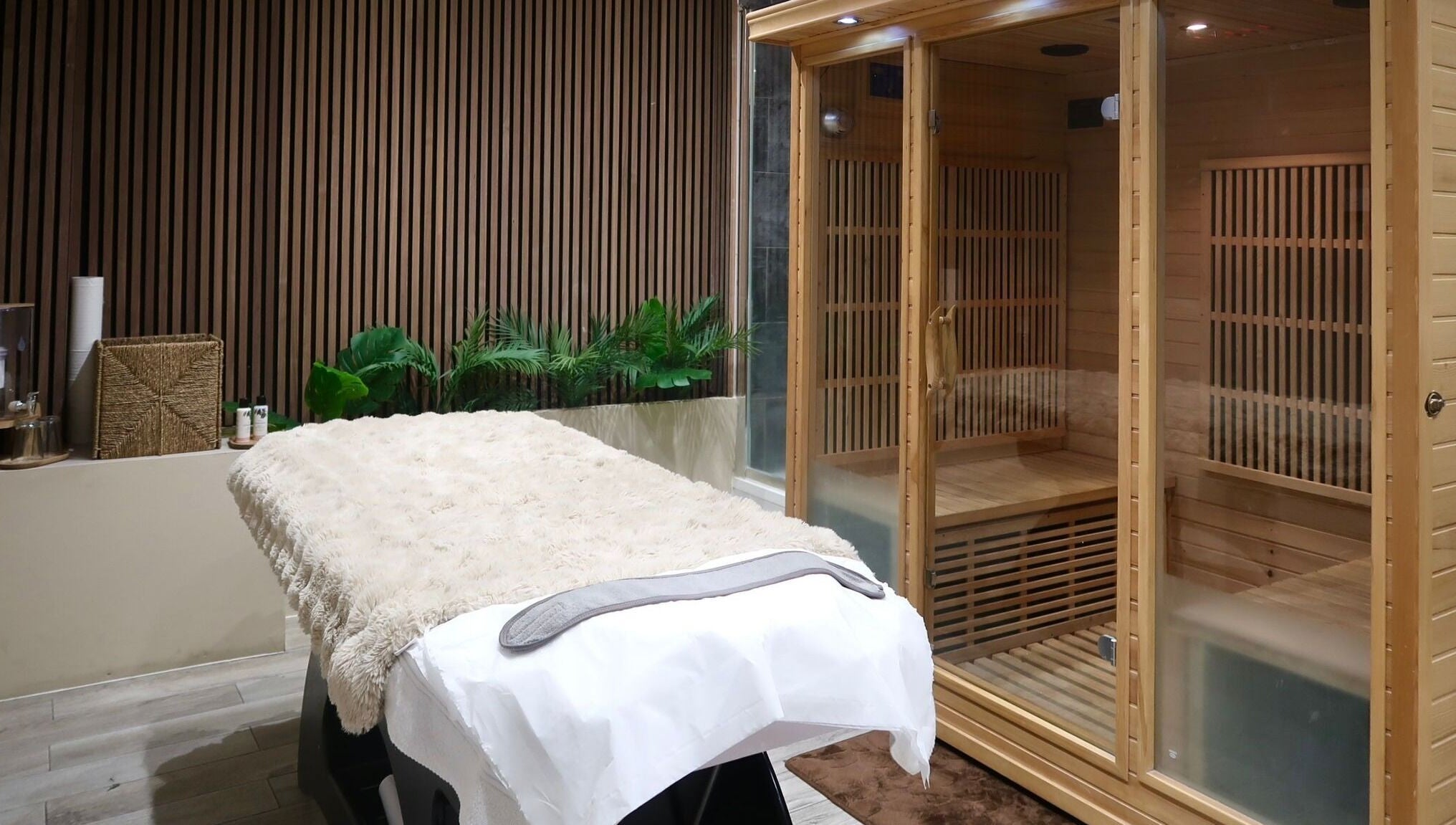 Luxurious massage and sauna room at Nu Haven, London, England, GB, showcasing relaxation and comfort.