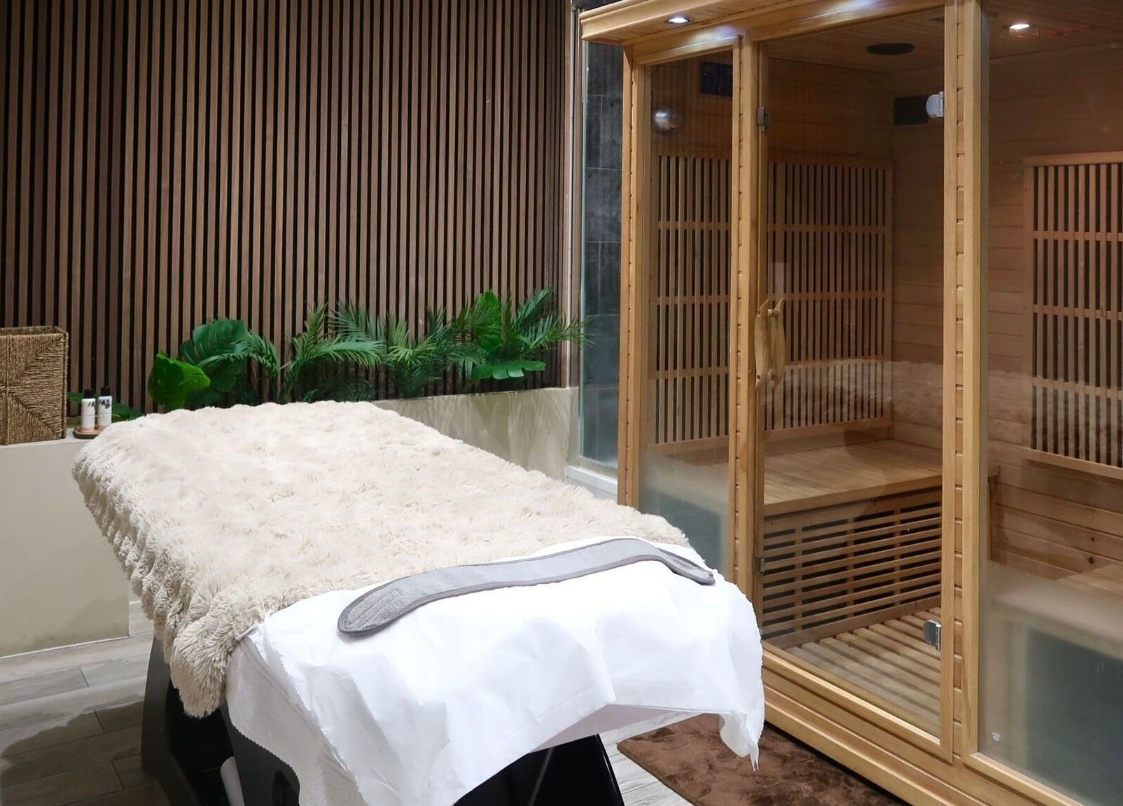 Luxurious massage and sauna room at Nu Haven, London, England, GB, showcasing relaxation and comfort.
