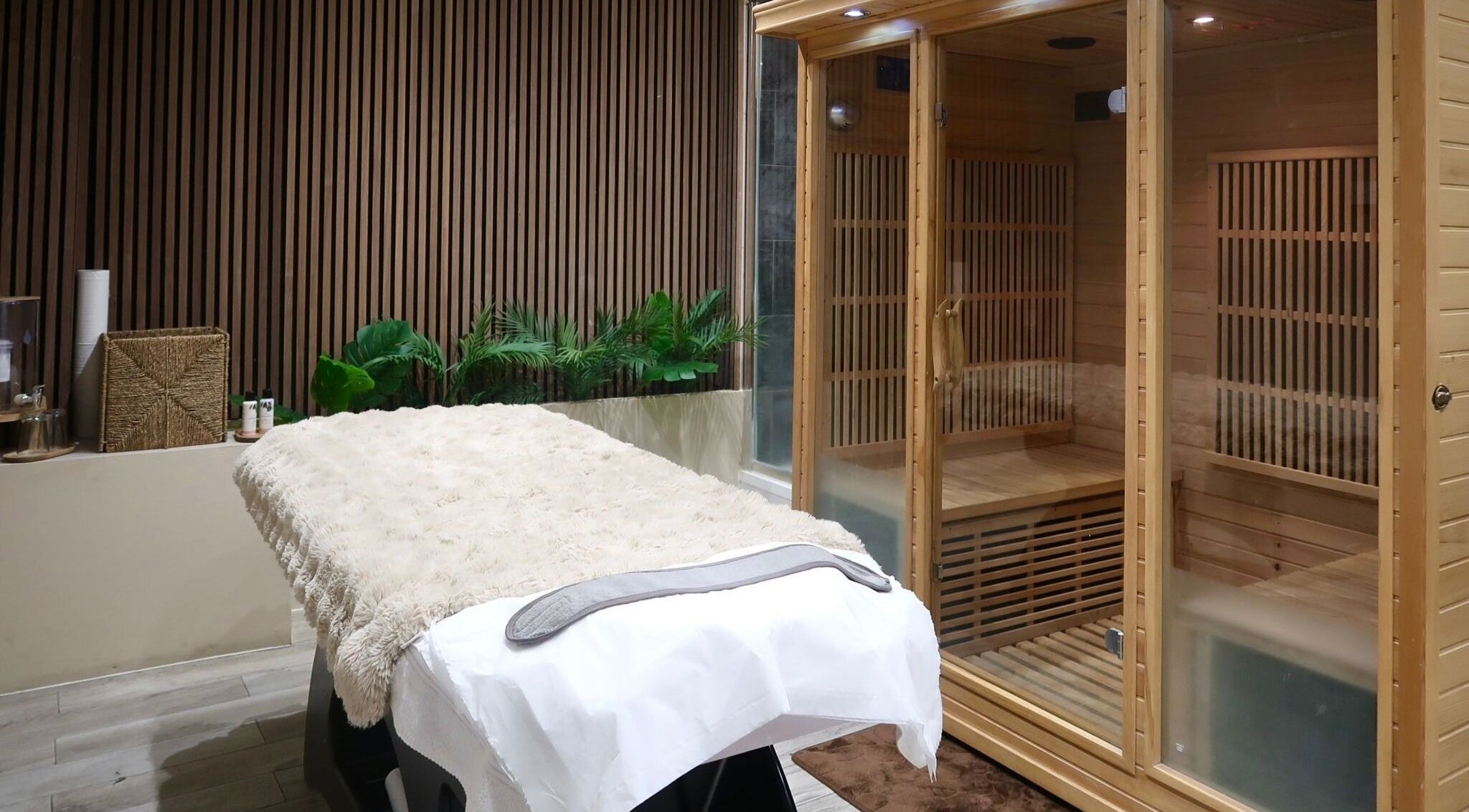Luxurious massage and sauna room at Nu Haven, London, England, GB, showcasing relaxation and comfort.