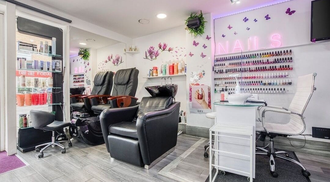 Elegant interior of Loveth Love Beauty and Hair Salon, London, England, GB featuring nail polish display.
